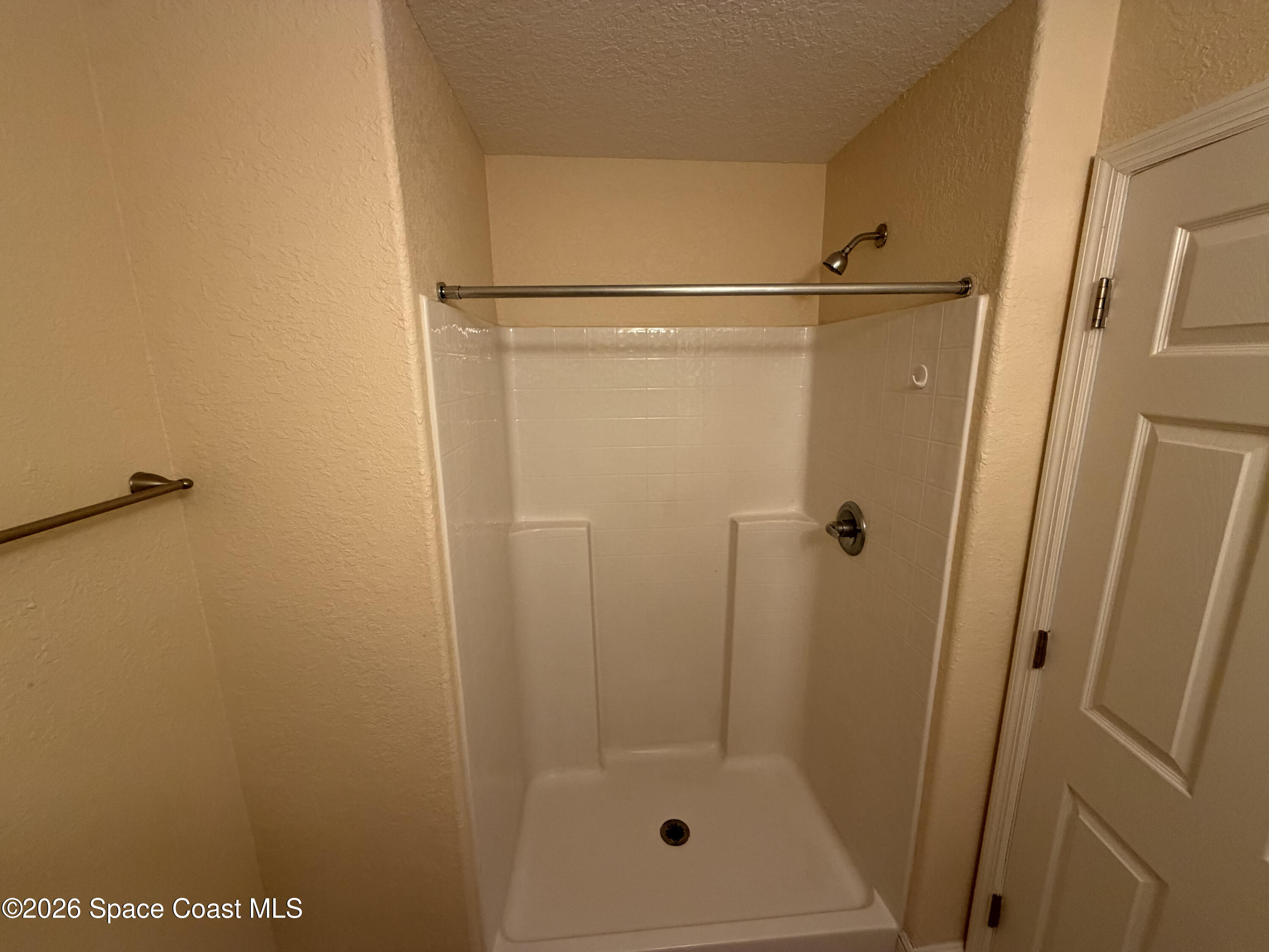 1904 Fletcher Street Melbourne, FL 32901 - Photo 18 of 23 a bathroom with a glass shower door