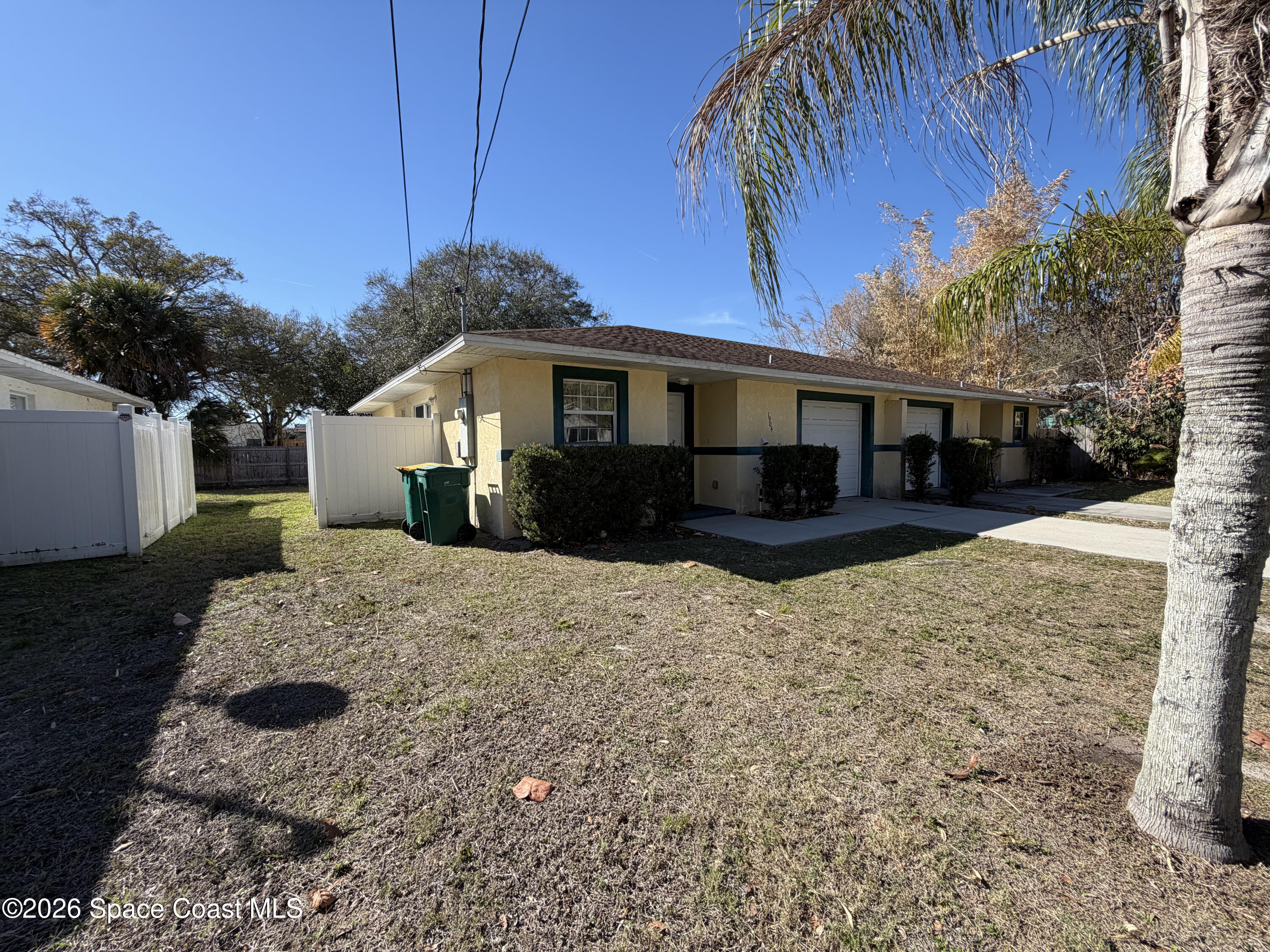 1904 Fletcher Street Melbourne, FL 32901 - Photo 2 of 23 a front view of a house with a yard