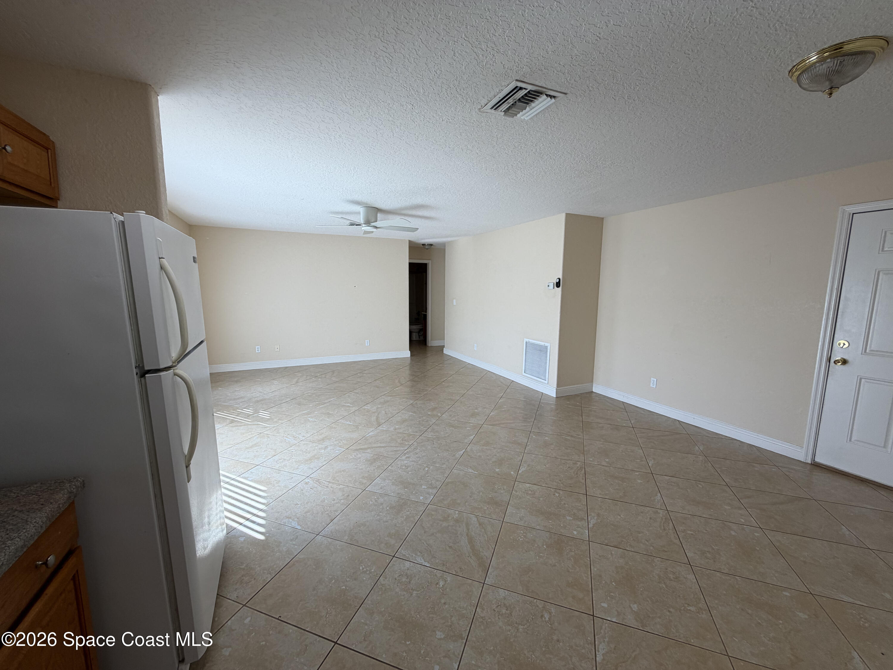 1904 Fletcher Street Melbourne, FL 32901 - Photo 7 of 23 a view of an empty room and a fireplace