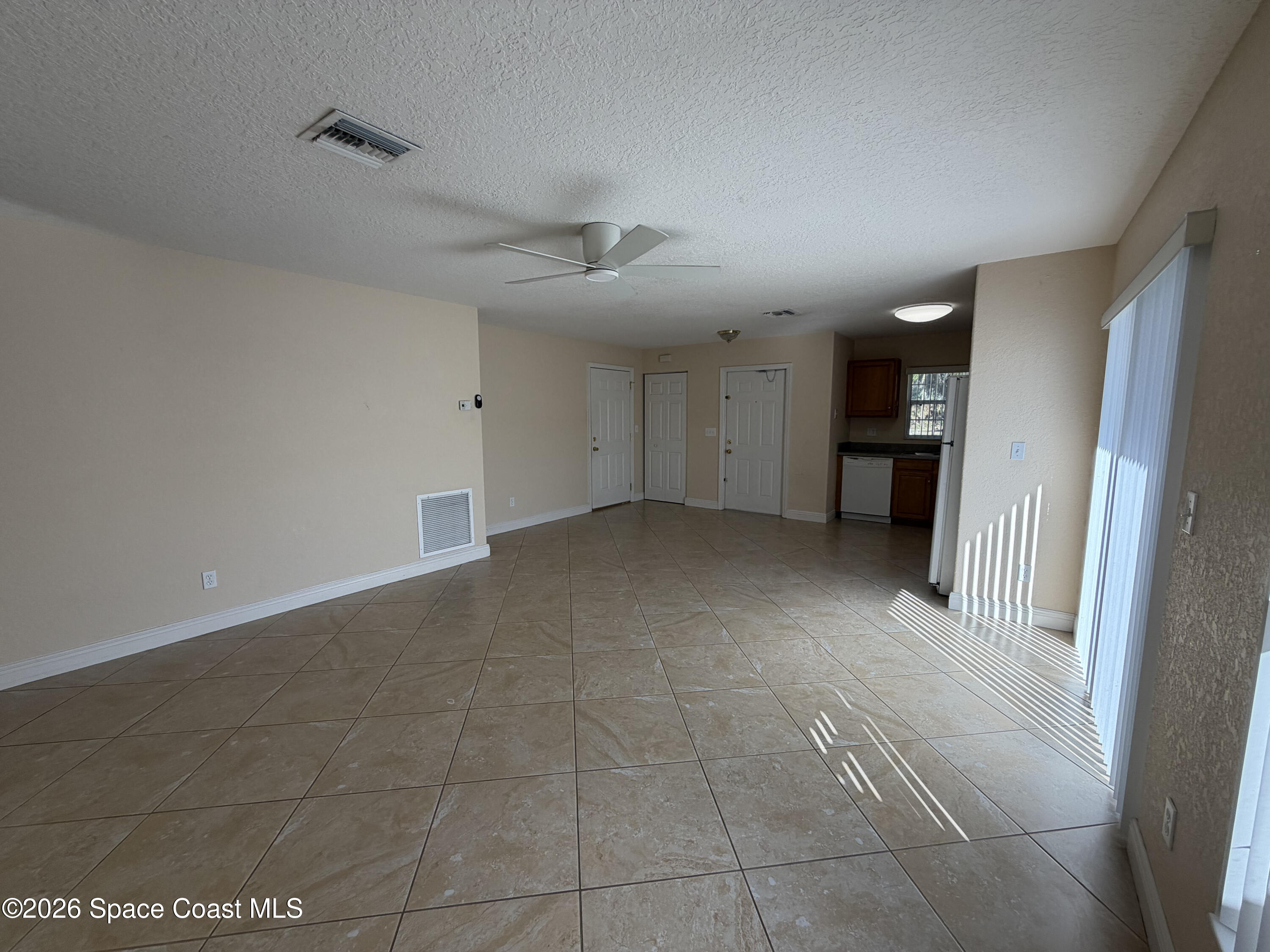 1904 Fletcher Street Melbourne, FL 32901 - Photo 9 of 23 a view of a livingroom with a kitchen