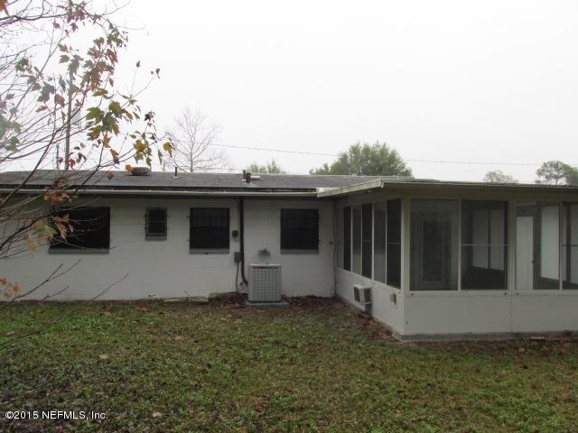 7658 Rambler Road Jacksonville, FL 32244 - Photo 13 of 13 a house with trees in the background