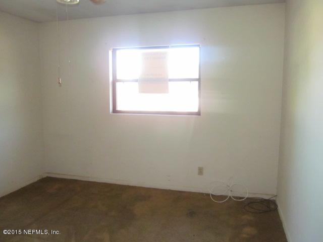 7658 Rambler Road Jacksonville, FL 32244 - Photo 4 of 13 an empty room with a window