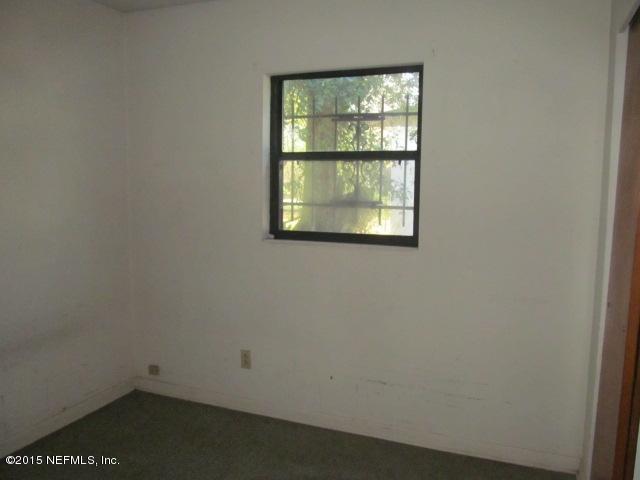 7658 Rambler Road Jacksonville, FL 32244 - Photo 5 of 13 an empty room with a window