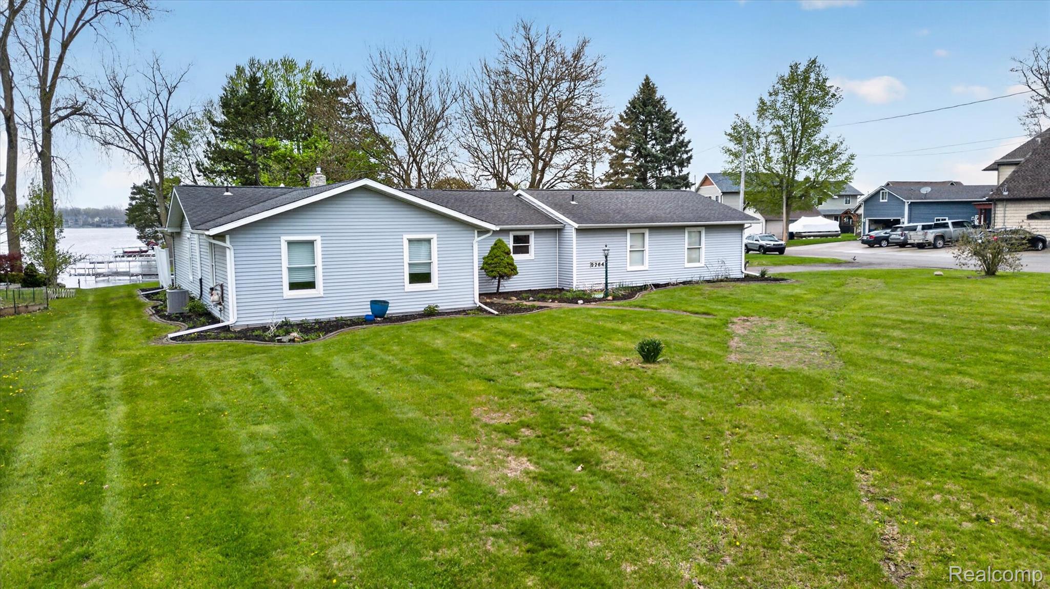 2264 Crane Road Fenton, MI 48430 - Photo 1 of 55 Rear view of house with a yard