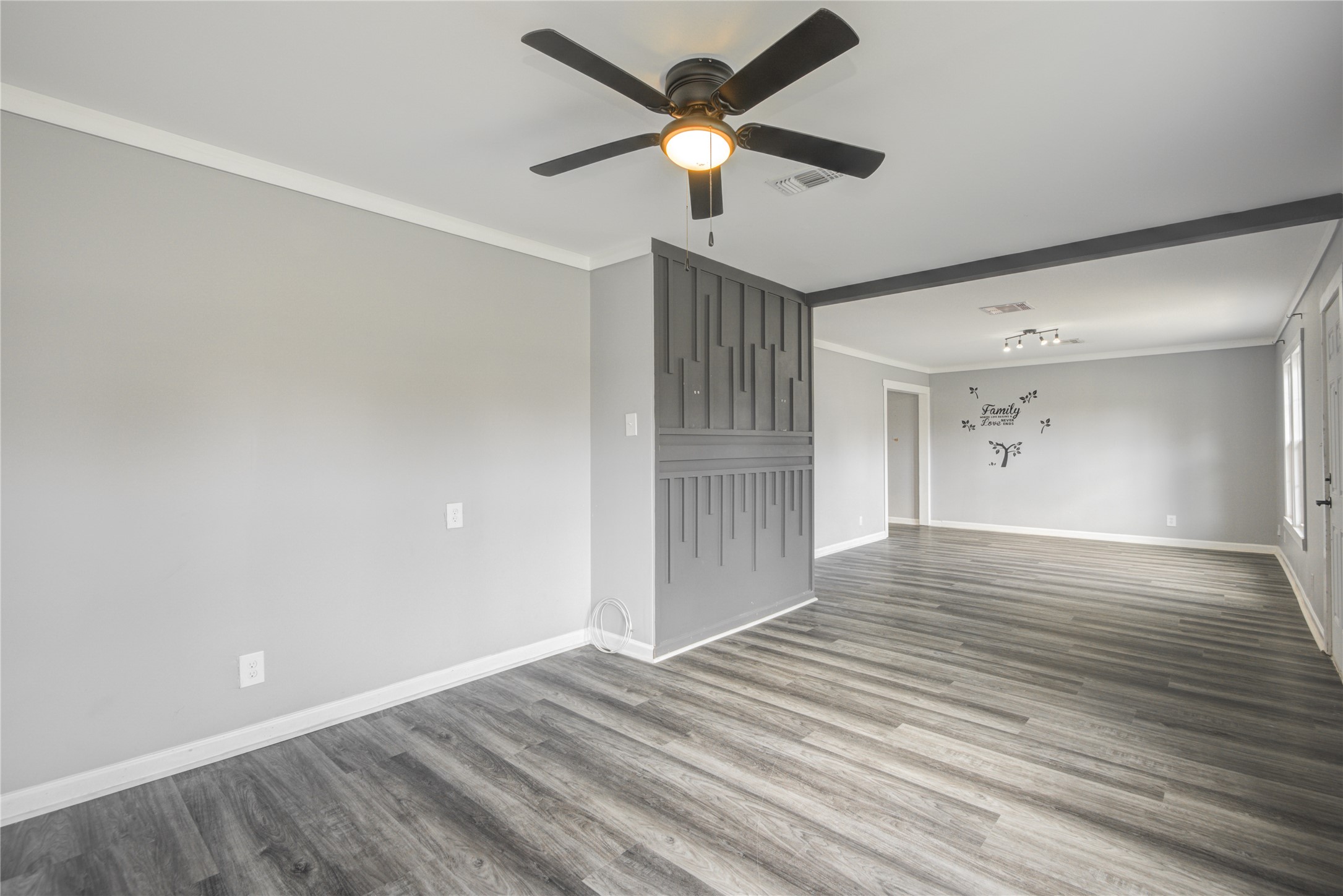 609 Hurst Place Angleton, TX 77515 - Photo 8 of 36 a view of empty room with wooden floor and ceiling fan