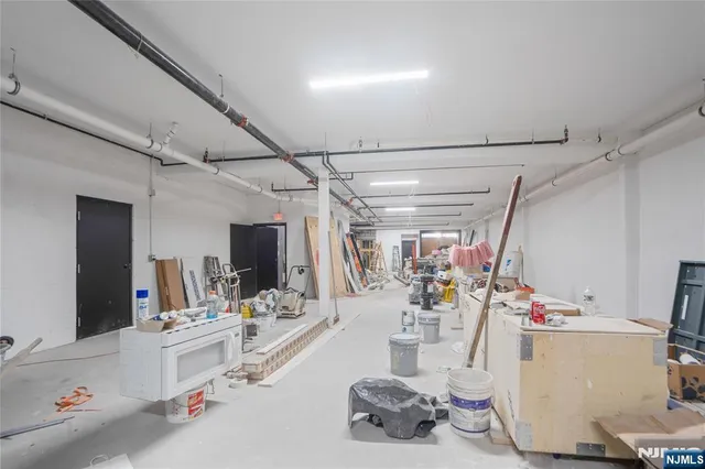 a room with gym equipment and mirror