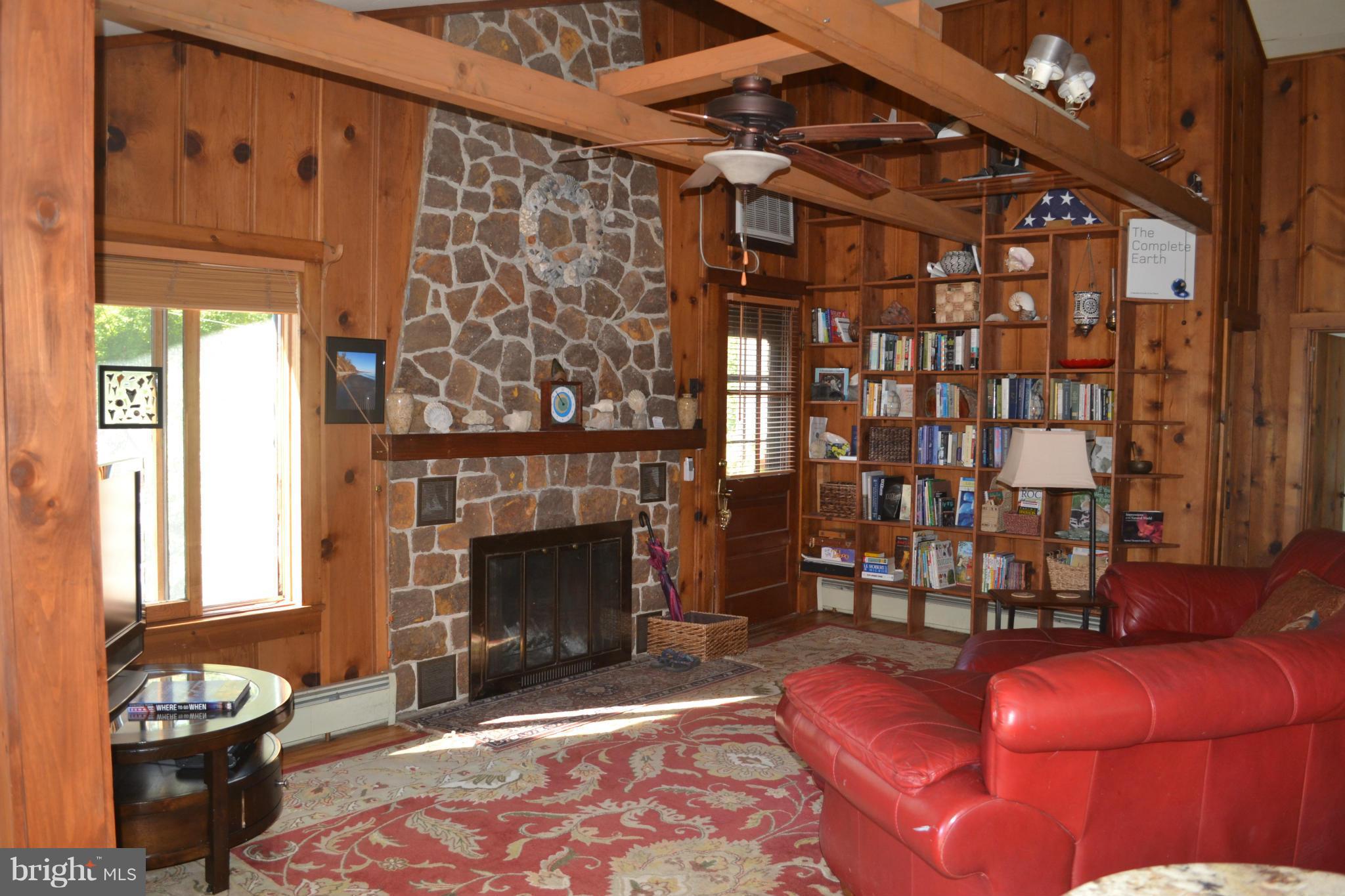 4012 Elder Road Port Republic, MD 20676 - Photo 4 of 25 a living room with furniture a fireplace and a window