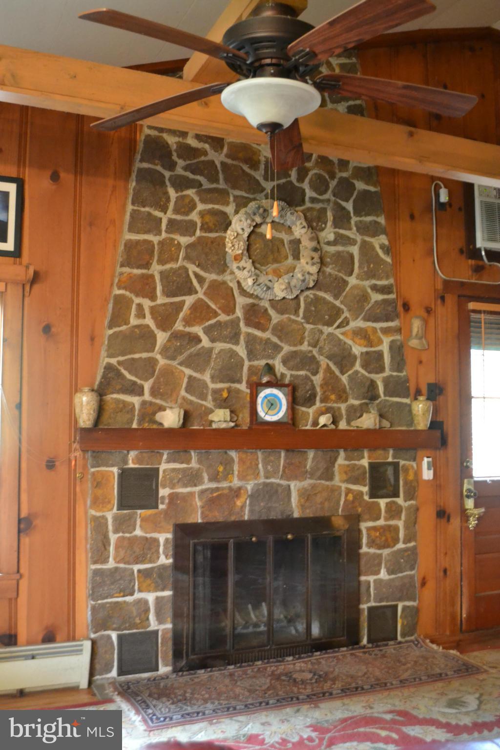 4012 Elder Road Port Republic, MD 20676 - Photo 5 of 25 a view of a fireplace with wooden door