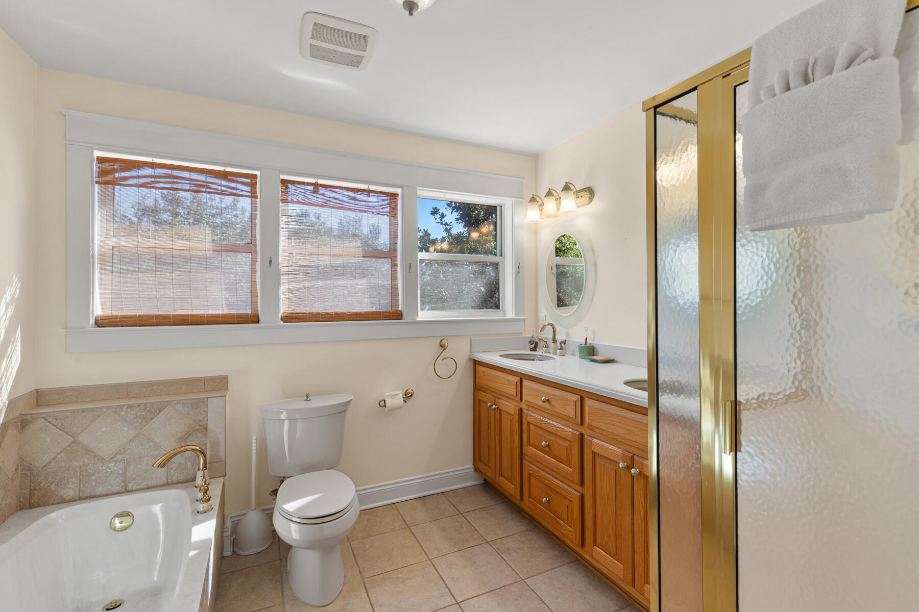 325 Botany Boulevard Santa Rosa Beach, FL 32459 - Photo 14 of 43 a bathroom with a double vanity sink toilet and mirror