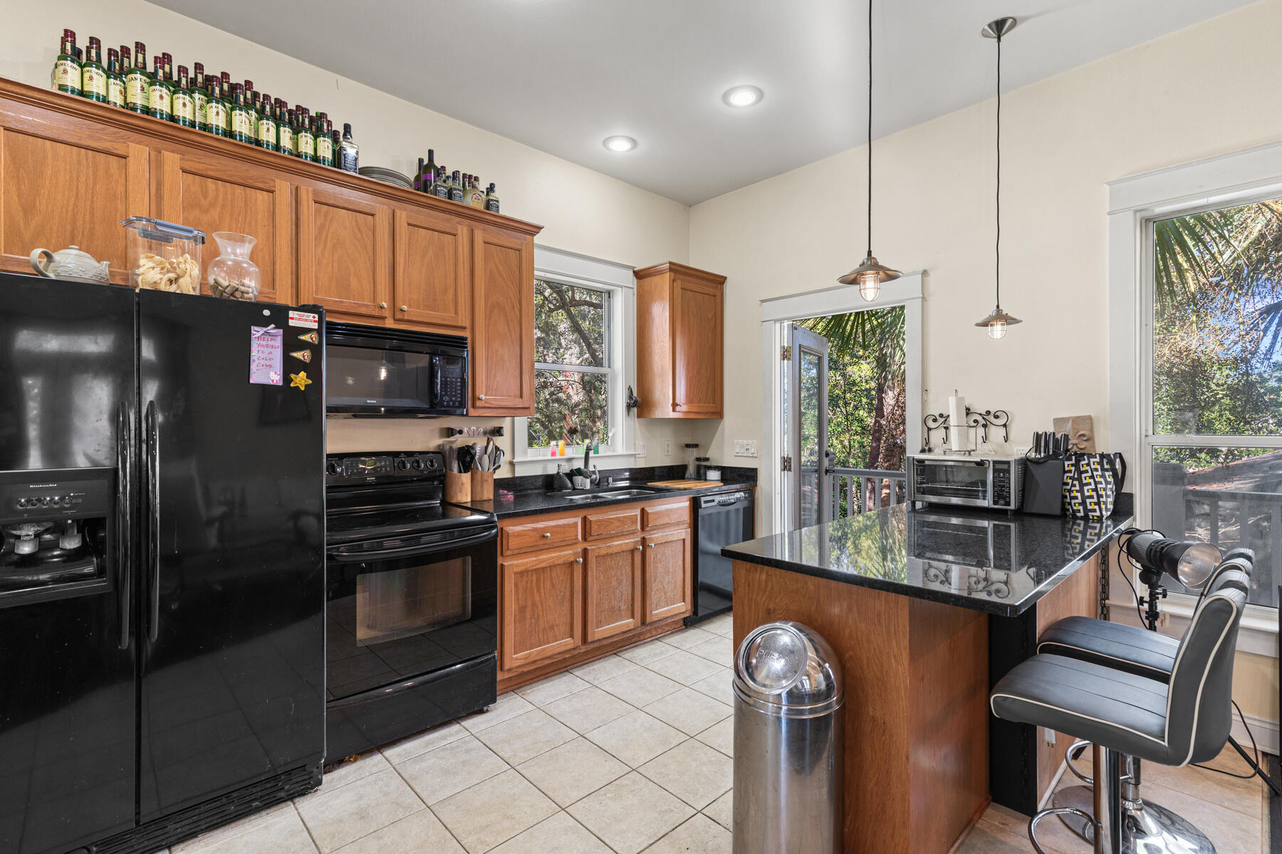 325 Botany Boulevard Santa Rosa Beach, FL 32459 - Photo 21 of 43 a kitchen with stainless steel appliances granite countertop a refrigerator a stove a sink and a microwave
