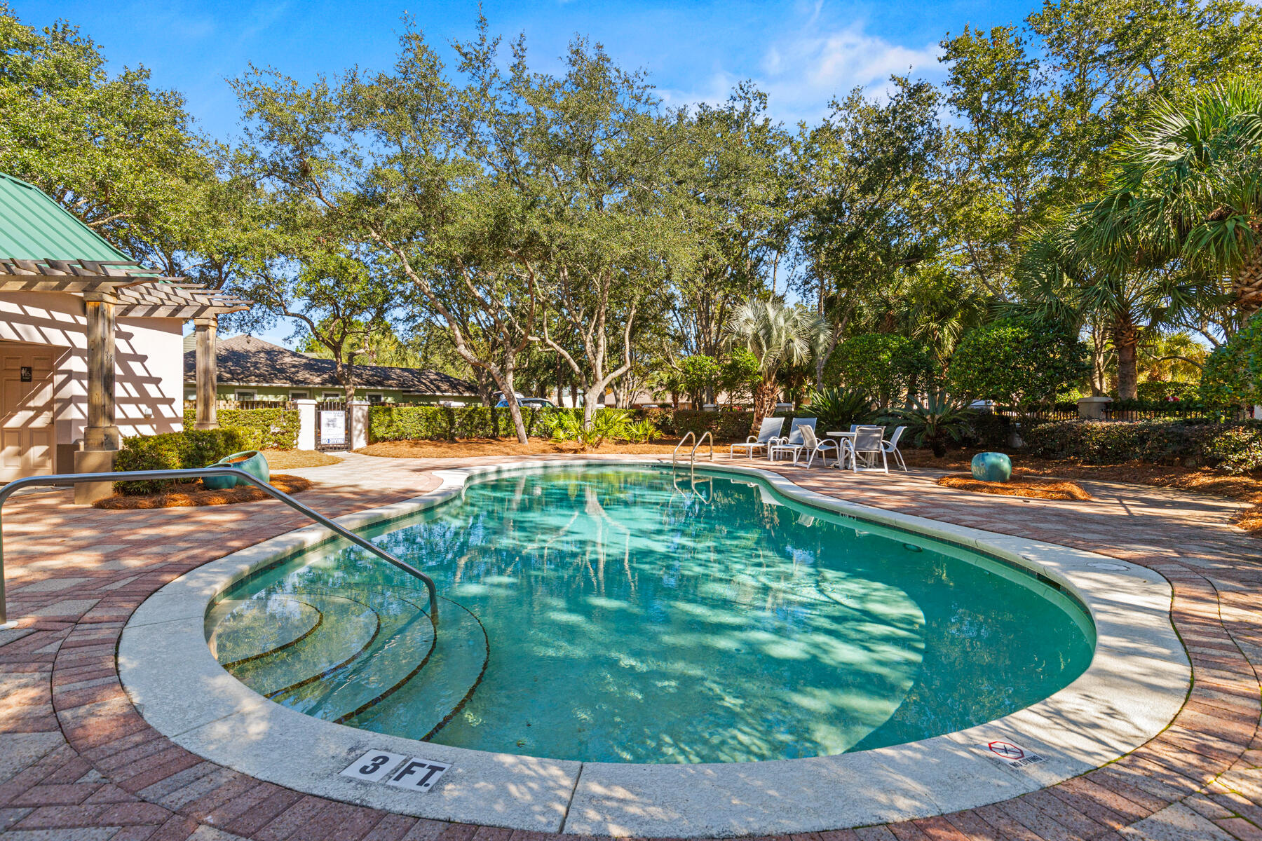 325 Botany Boulevard Santa Rosa Beach, FL 32459 - Photo 34 of 43 a swimming pool with outdoor seating and trees