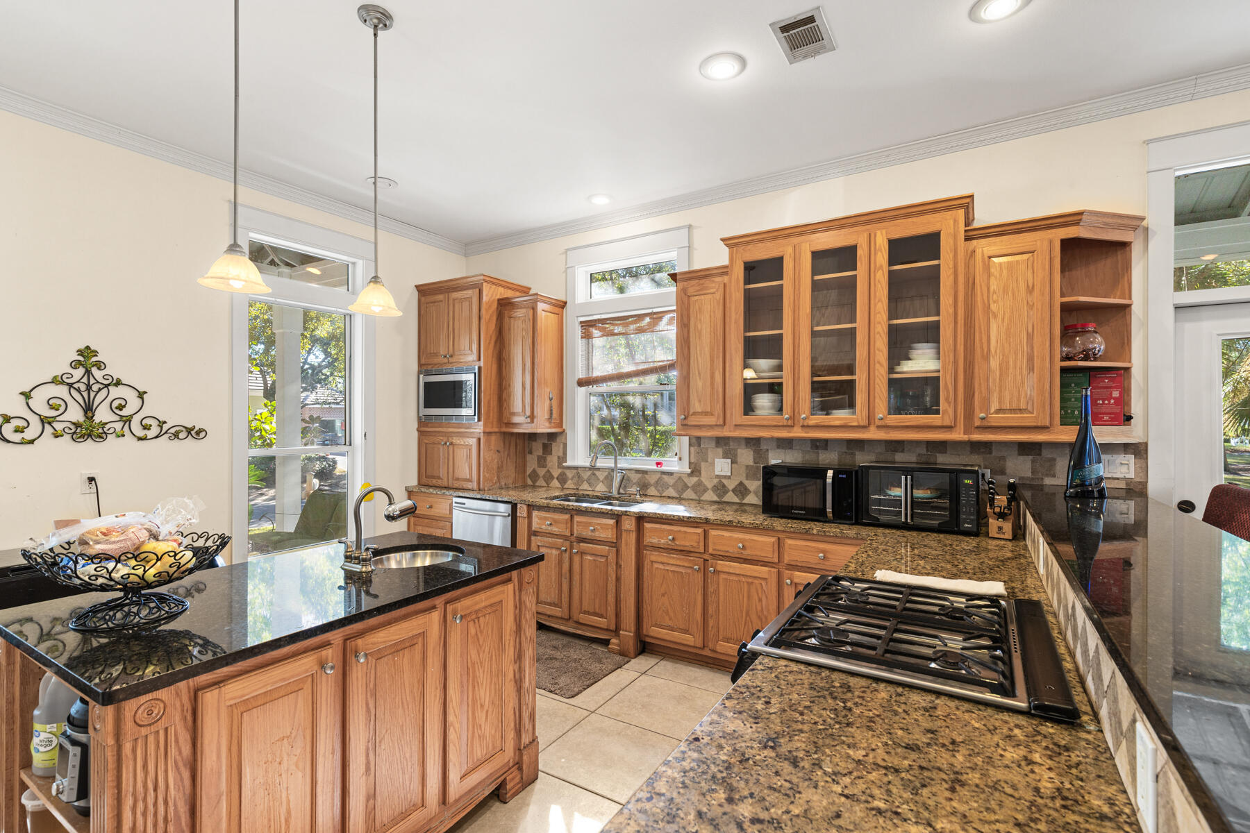 325 Botany Boulevard Santa Rosa Beach, FL 32459 - Photo 4 of 43 a kitchen with granite countertop a stove and a sink