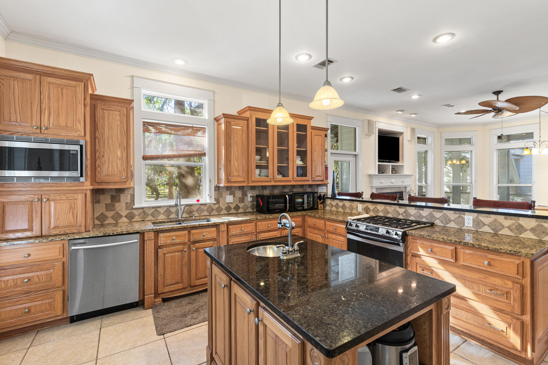 325 Botany Boulevard Santa Rosa Beach, FL 32459 - Photo 6 of 43 a kitchen with stainless steel appliances granite countertop stove microwave and sink