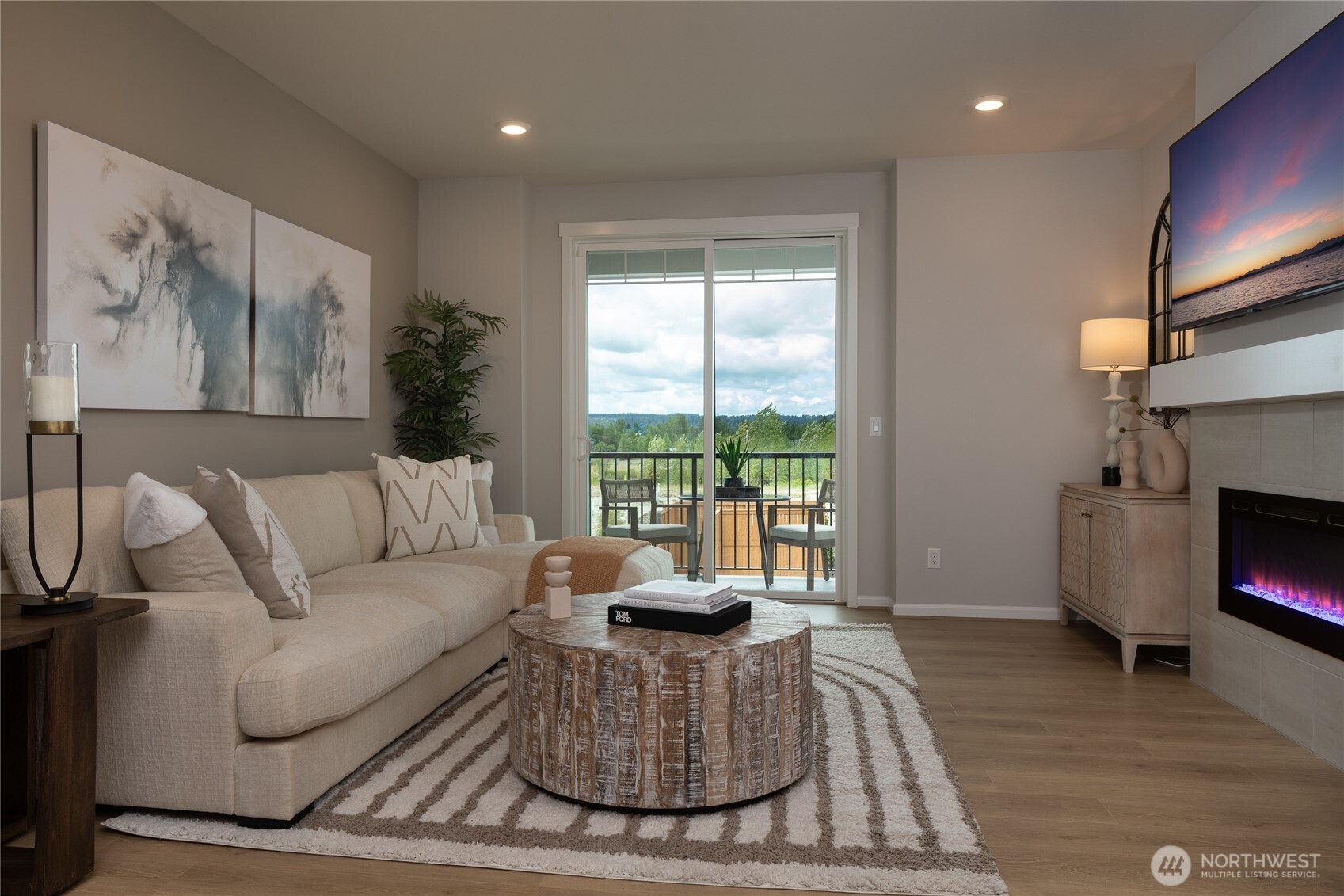 19288 Northeast 69th Circle, Unit 103 Redmond, WA 98052 - Photo 4 of 11 a living room with furniture fireplace and a large window