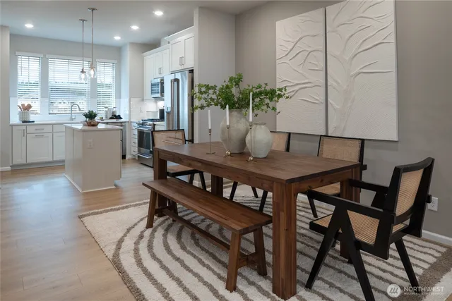 a view of a dining room with furniture and window