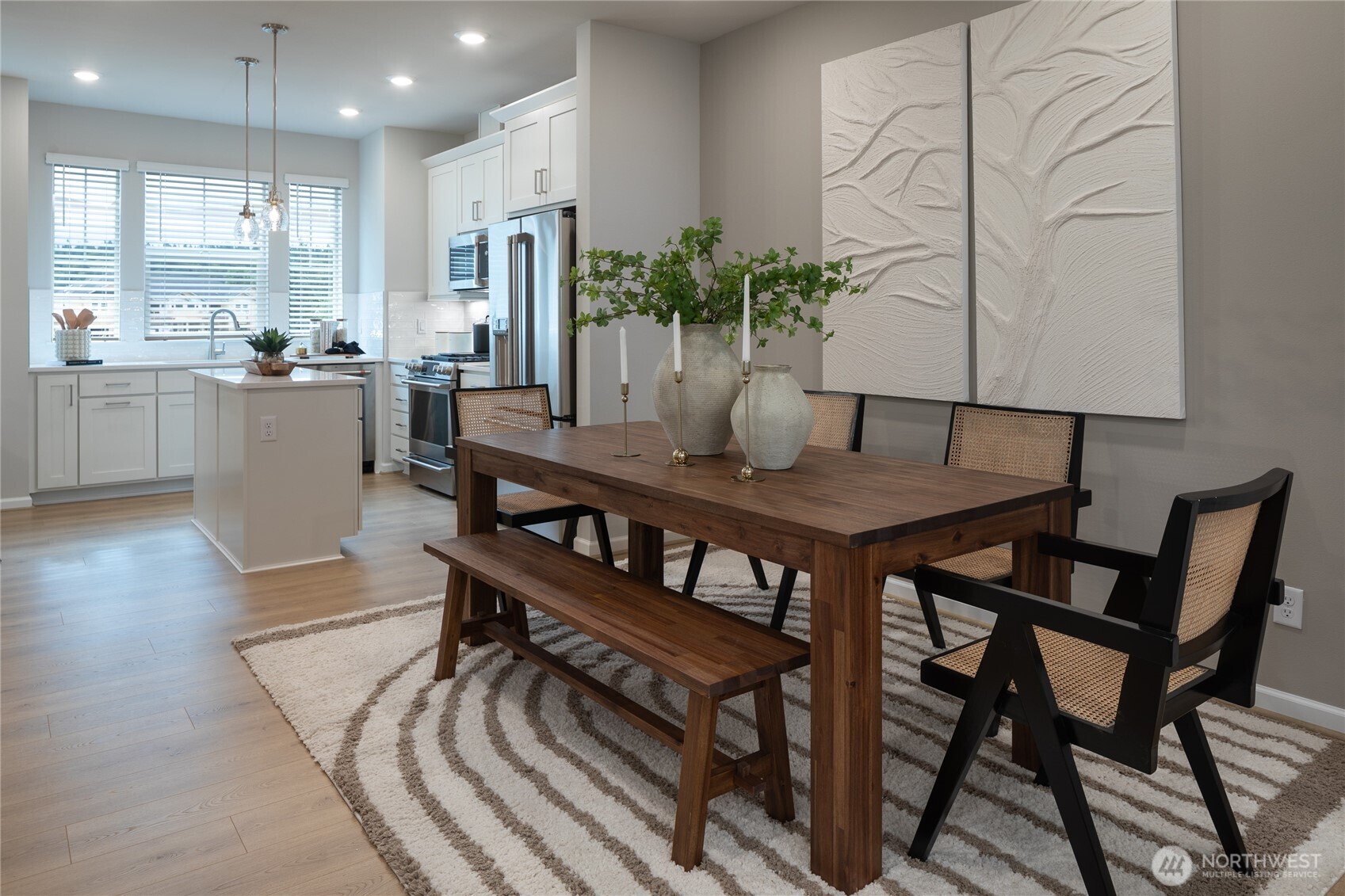 19288 Northeast 69th Circle, Unit 103 Redmond, WA 98052 - Photo 7 of 11 a dining room with furniture and wooden floor