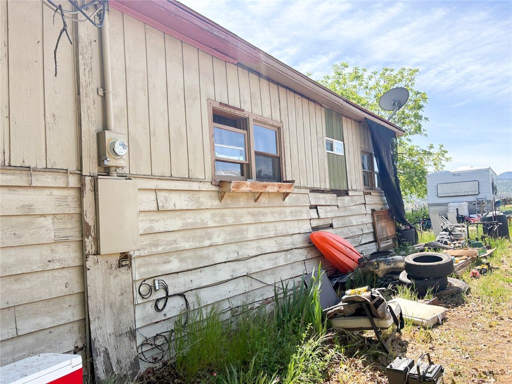 324 Henley Hornbrook Road Hornbrook, CA 96044 - Photo 9 of 9 a backyard of a house with outdoor seating
