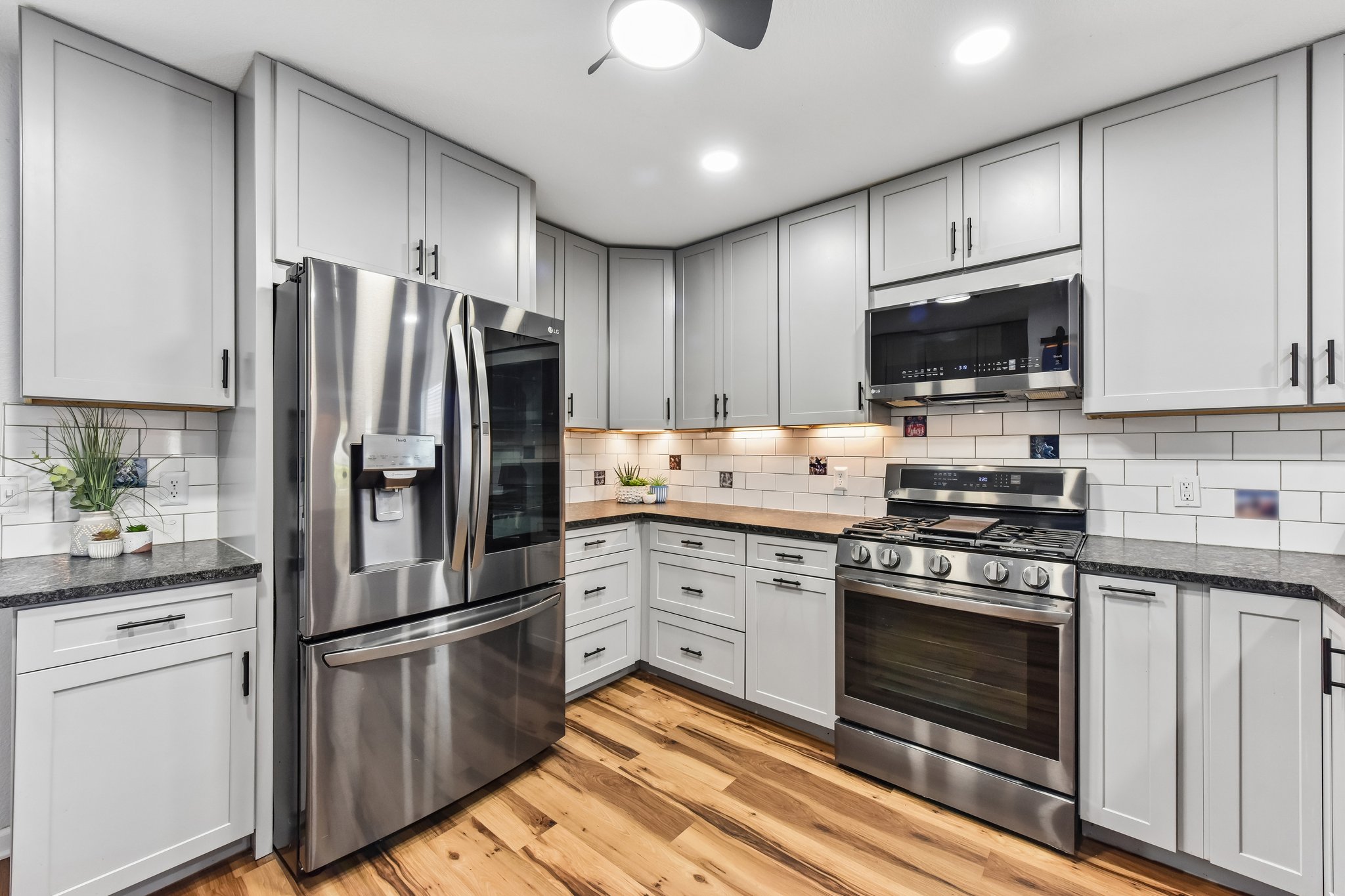 5405 Rusk Court Austin, TX 78723 - Photo 4 of 40 A well-appointed kitchen showcasing elegant cabinetry and modern stainless steel appliances.