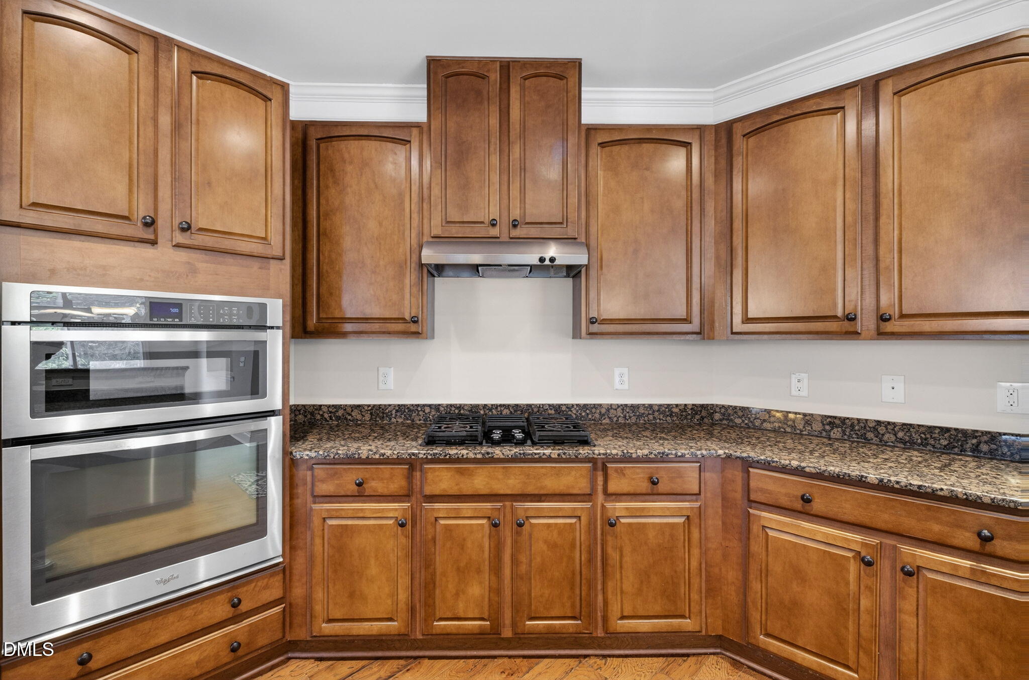 1304 Barnford Mill Road Wake Forest, NC 27587 - Photo 12 of 44 a kitchen with stainless steel appliances granite countertop a stove and a microwave