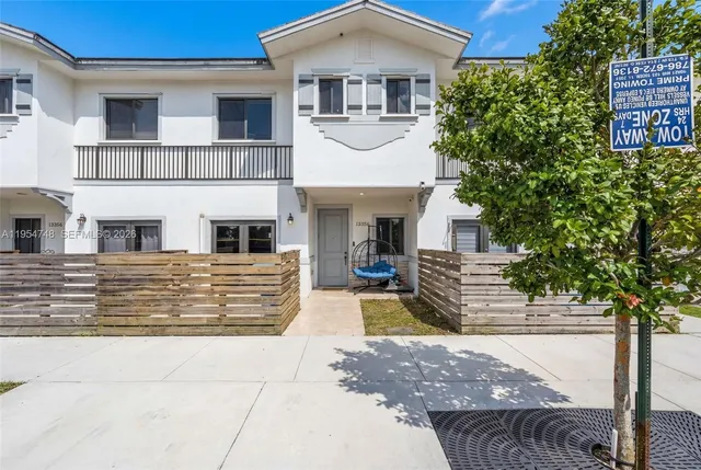 a front view of a house with garage