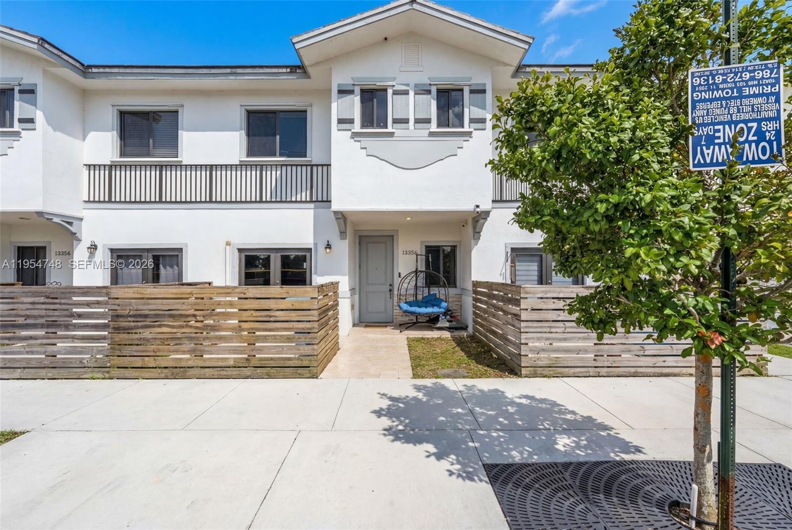 a front view of a house with garage