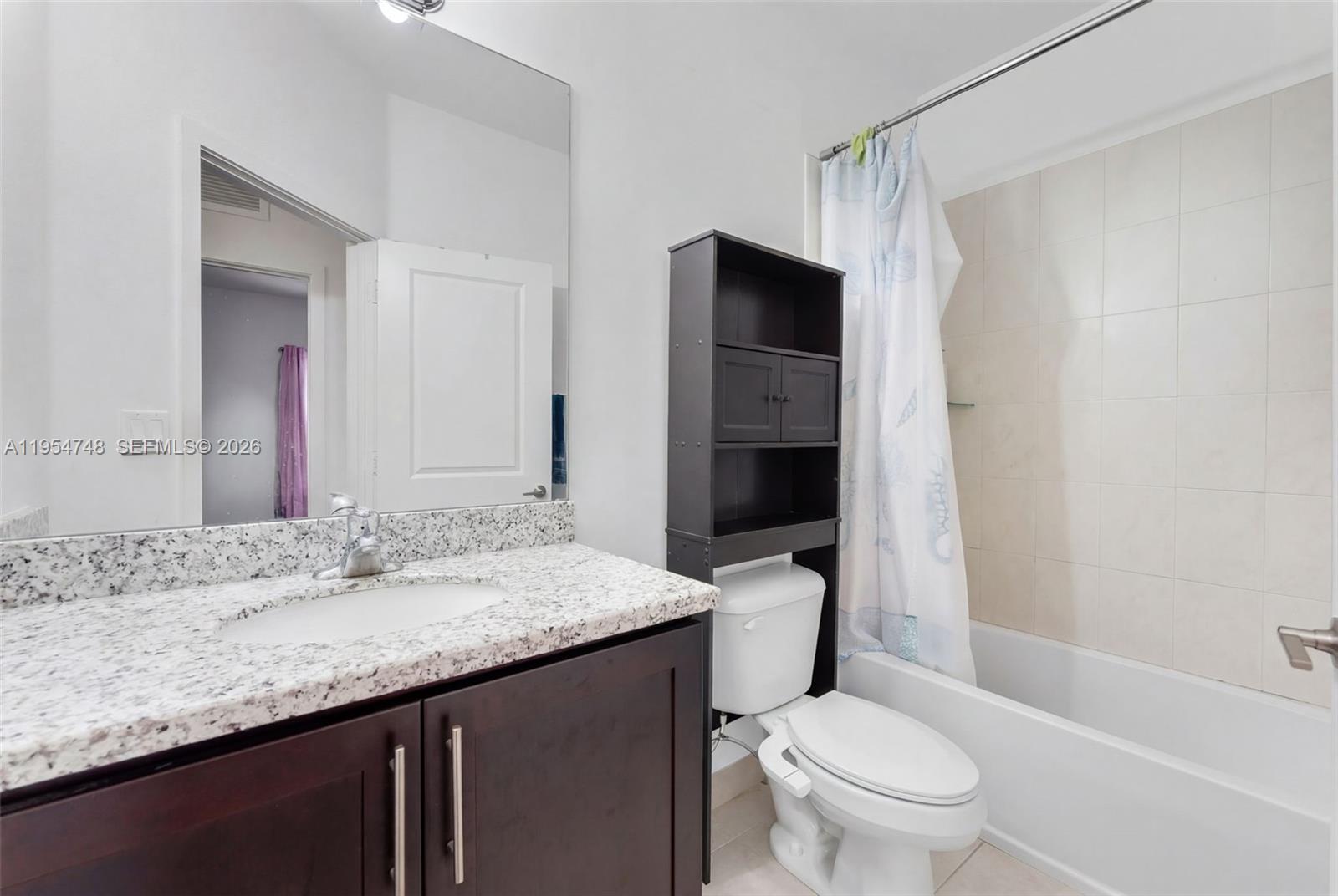 13356 Southwest 250th Street Homestead, FL 33032 - Photo 12 of 21 a bathroom with a granite countertop sink toilet mirror and shower