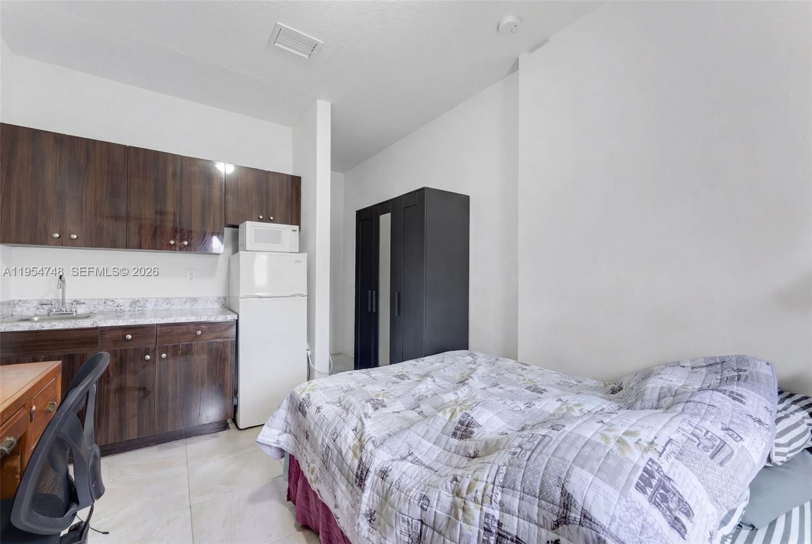 13356 Southwest 250th Street Homestead, FL 33032 - Photo 14 of 21 a bedroom with a bed and a sink