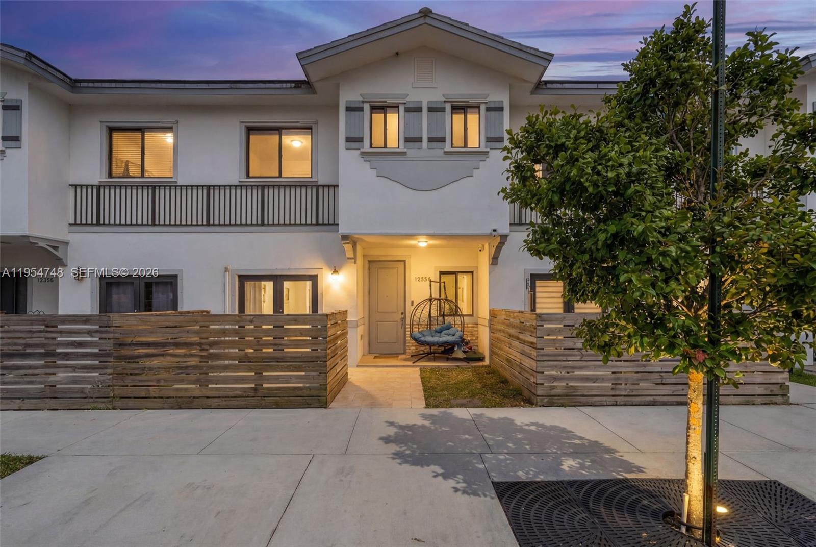 13356 Southwest 250th Street Homestead, FL 33032 - Photo 2 of 21 a front view of a house with a yard