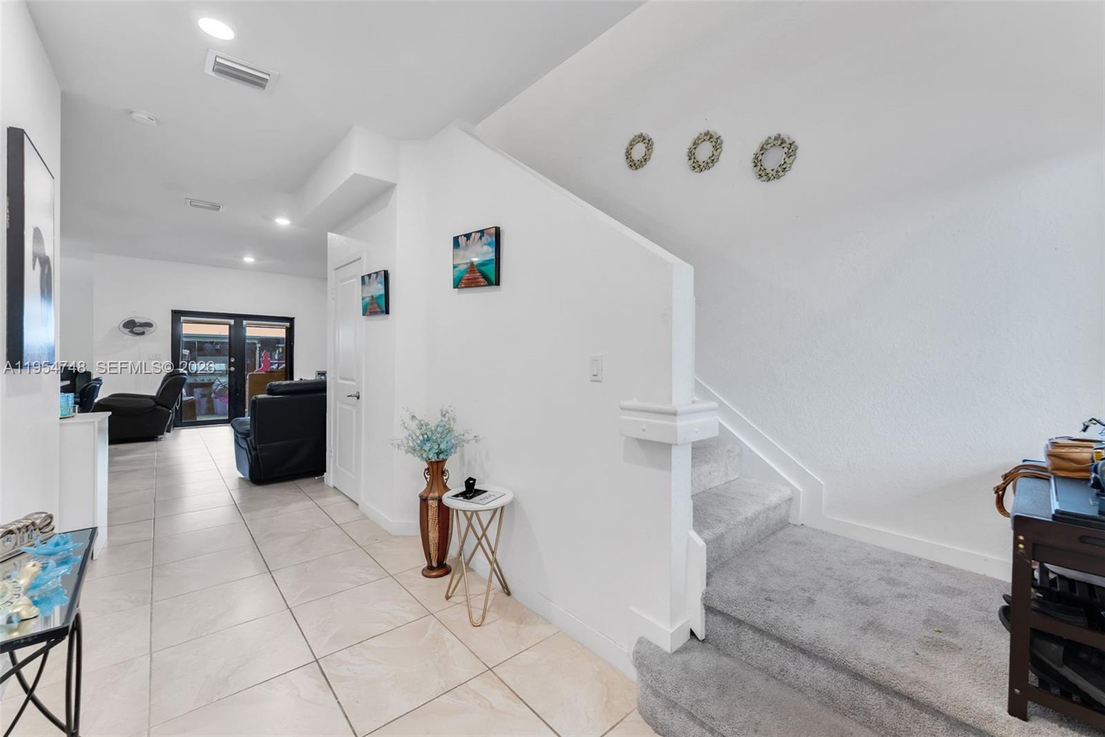 13356 Southwest 250th Street Homestead, FL 33032 - Photo 3 of 21 a living room with furniture and a flat screen tv