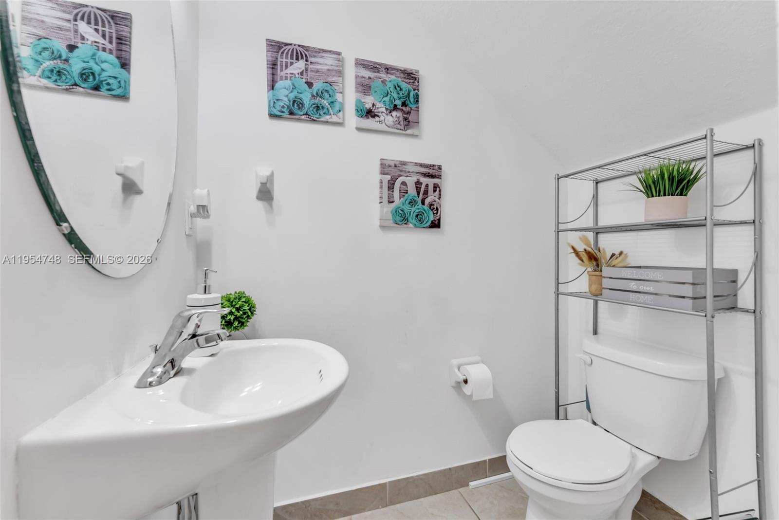 13356 Southwest 250th Street Homestead, FL 33032 - Photo 4 of 21 a bathroom with a sink mirror and toilet