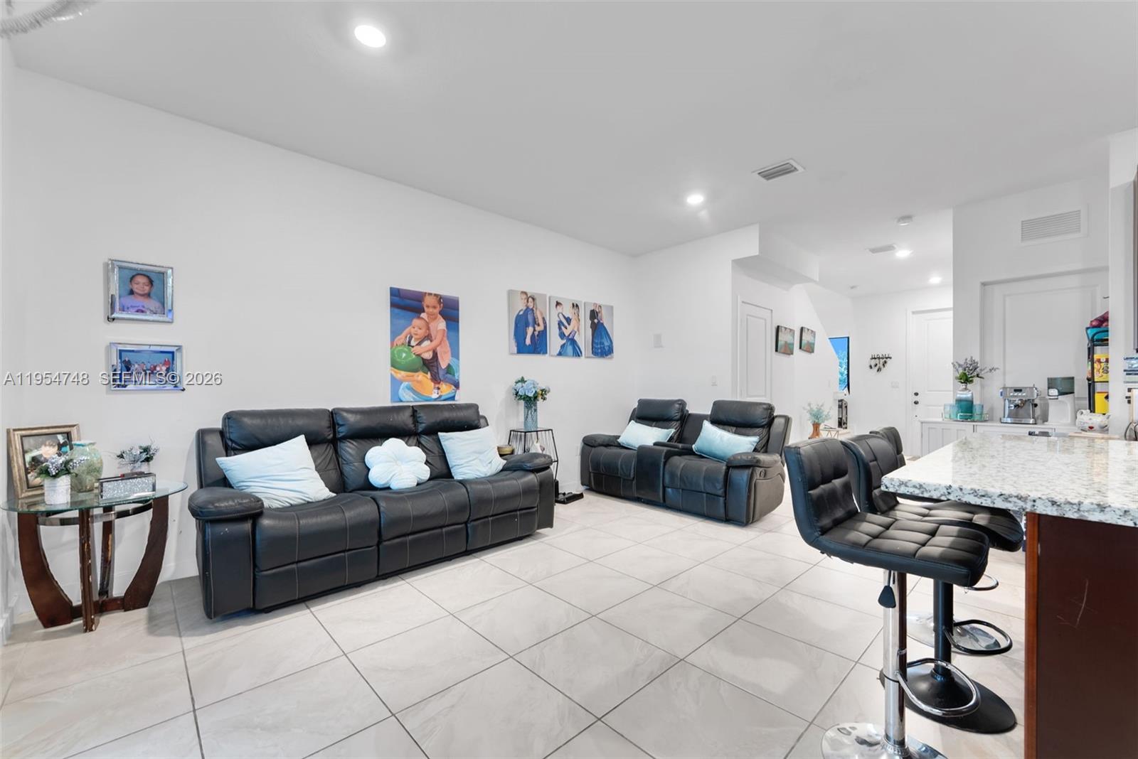 13356 Southwest 250th Street Homestead, FL 33032 - Photo 7 of 21 a living room with furniture and a table