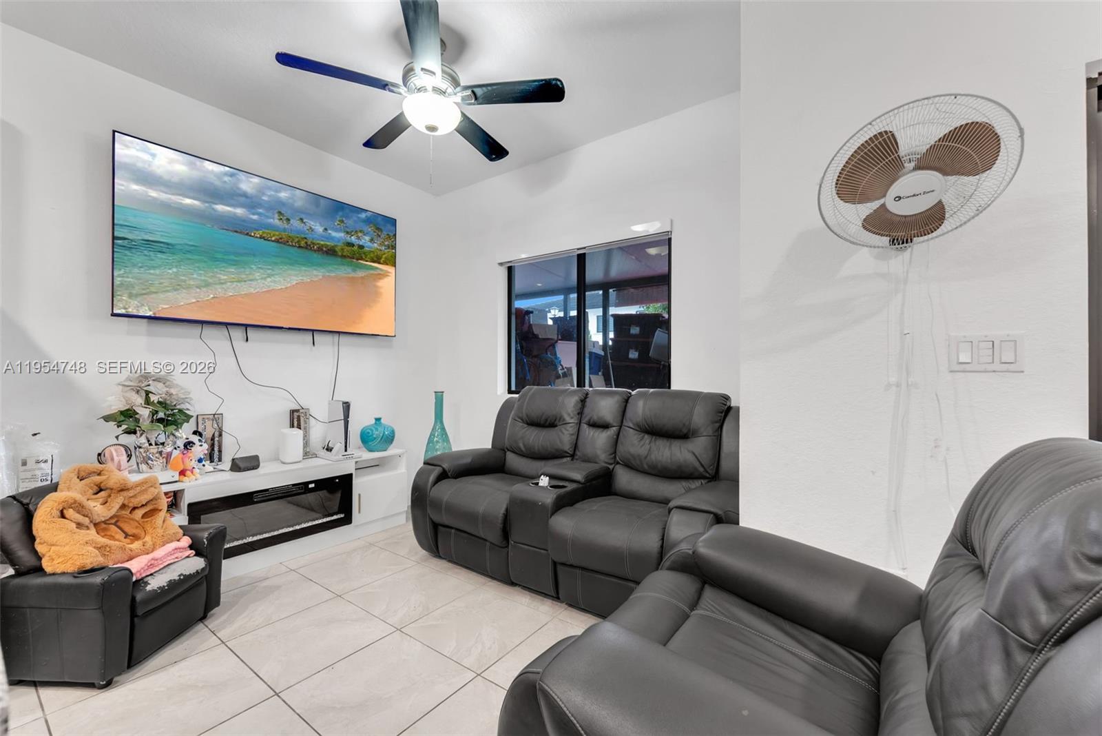 13356 Southwest 250th Street Homestead, FL 33032 - Photo 8 of 21 a living room with furniture and a flat screen tv