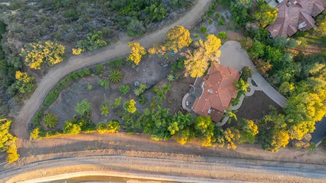 a view of a swimming pool with a yard
