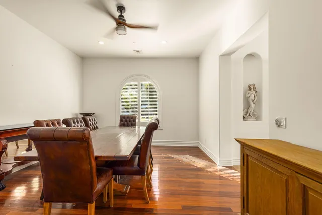 a dining room with furniture and window