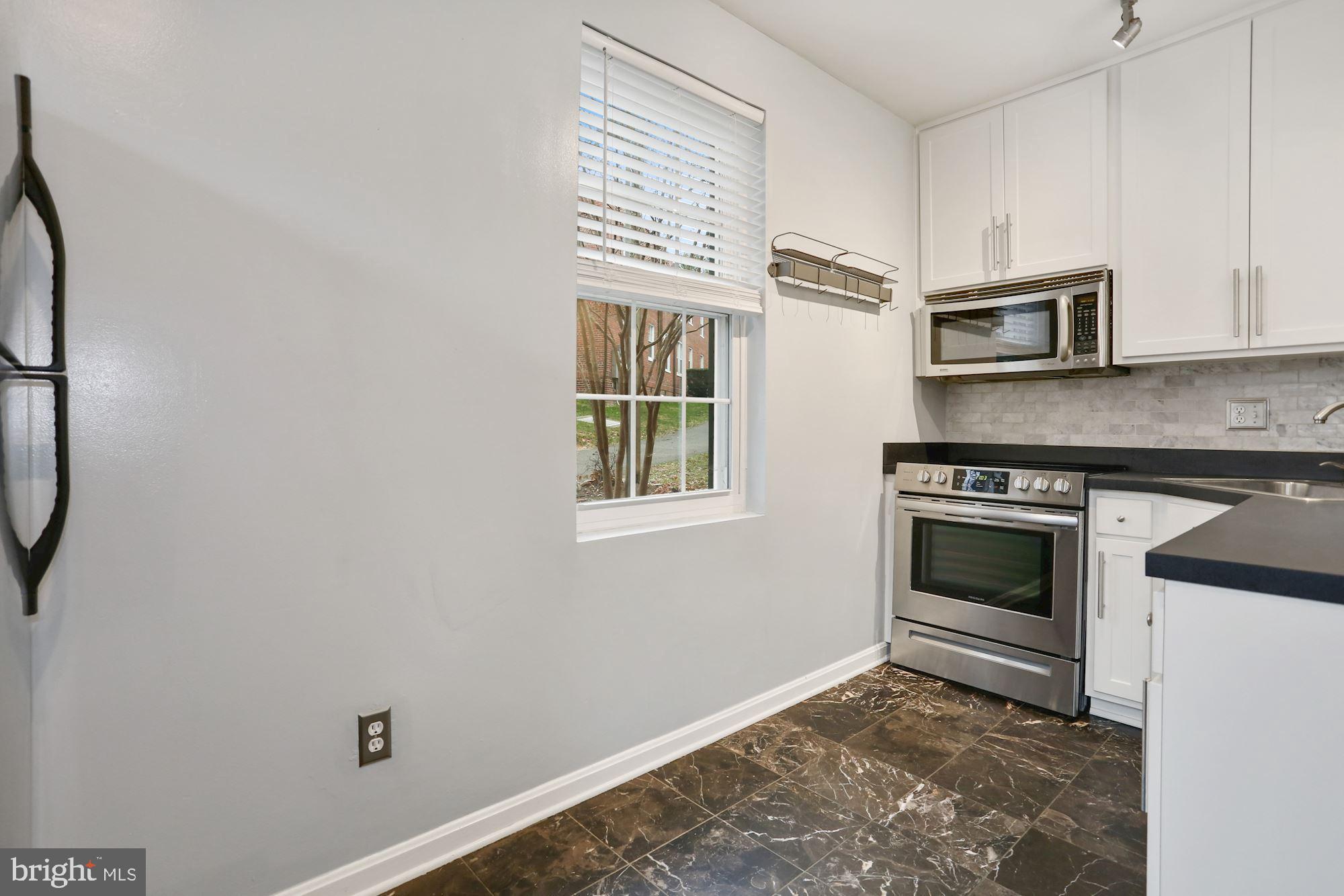 1900 North Rhodes Street, Unit 69 Arlington, VA 22201 - Photo 13 of 19 Electric Stove and Microwave
