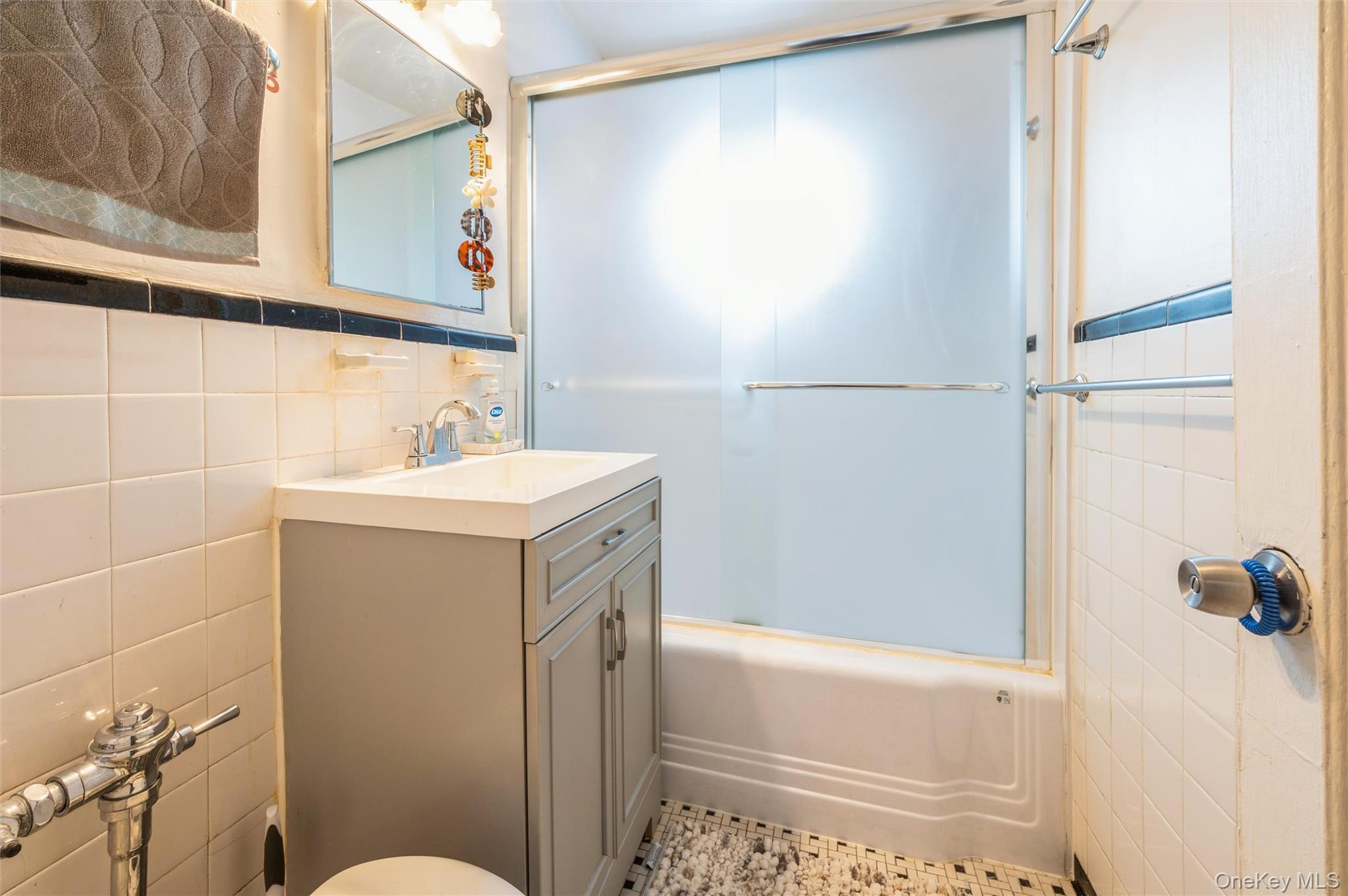 755 Bronx River Road, Unit 1C Bronxville, NY 10708 - Photo 11 of 16 a bathroom with a sink a toilet and shower