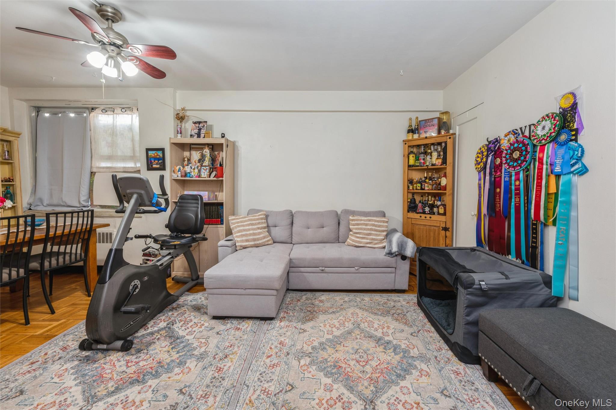 755 Bronx River Road, Unit 1C Bronxville, NY 10708 - Photo 5 of 16 a living room with furniture and a flat screen tv