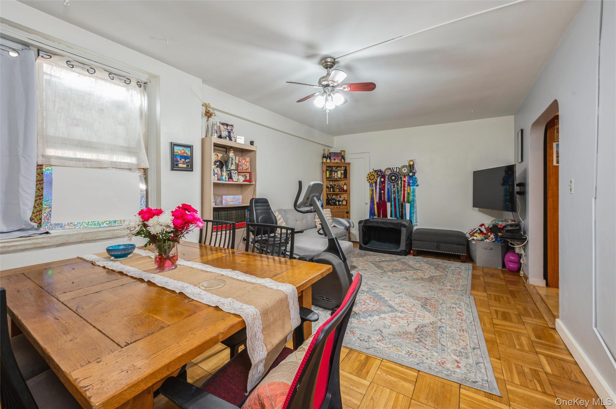 755 Bronx River Road, Unit 1C Bronxville, NY 10708 - Photo 6 of 16 a view of a dining room with furniture and a chandelier