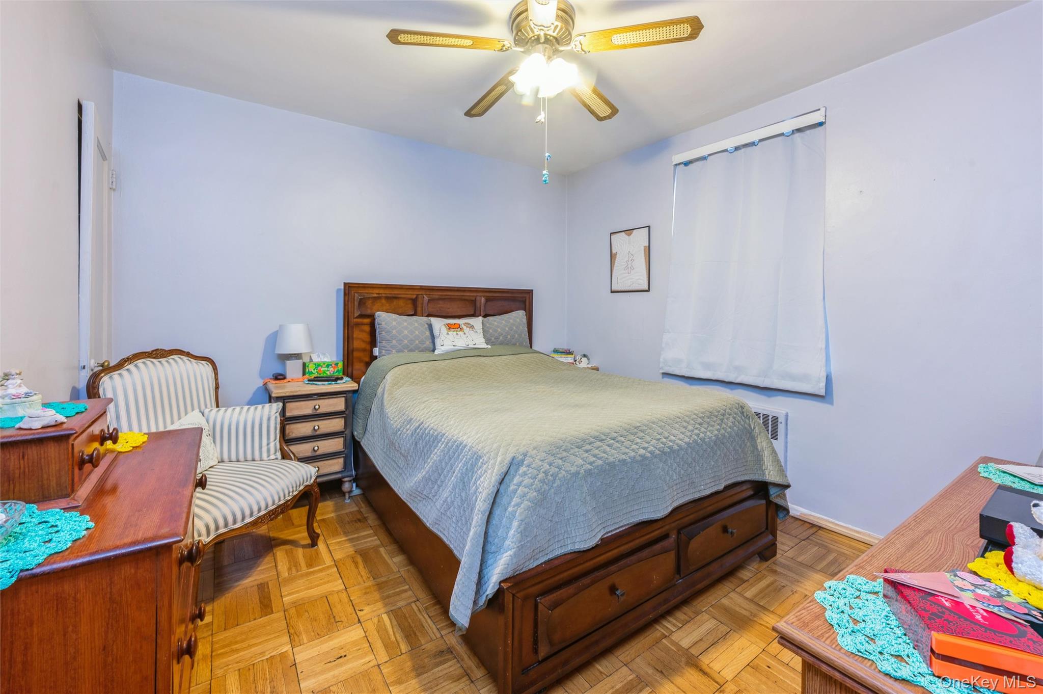 755 Bronx River Road, Unit 1C Bronxville, NY 10708 - Photo 8 of 16 a bed room with a bed and a chandelier