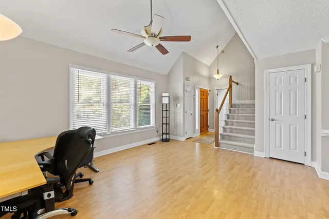 a kitchen with stainless steel appliances granite countertop a sink a stove and a refrigerator