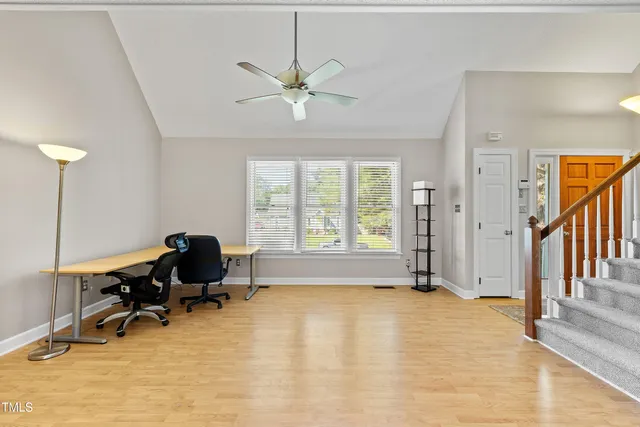 a kitchen with stainless steel appliances granite countertop a refrigerator a stove and a sink