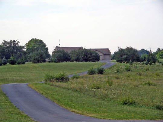 1723 East Spring Creek Road Oregon, IL 61061 - Photo 2 of 6 a view of a grassy field with trees
