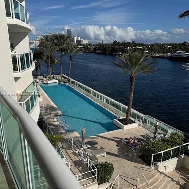 20201 East Country Club Drive, Unit 409 Aventura, FL 33180 - Photo 2 of 12 a view of a balcony with chairs