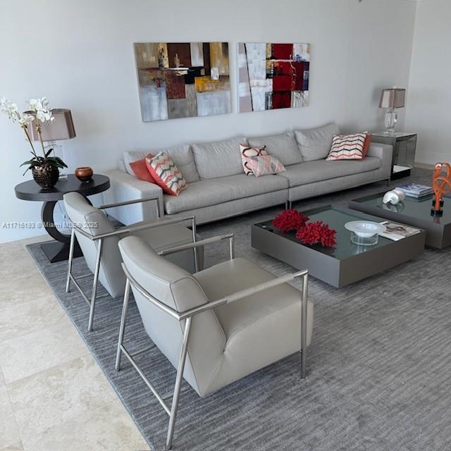 20201 East Country Club Drive, Unit 409 Aventura, FL 33180 - Photo 6 of 12 a living room with furniture and a couch