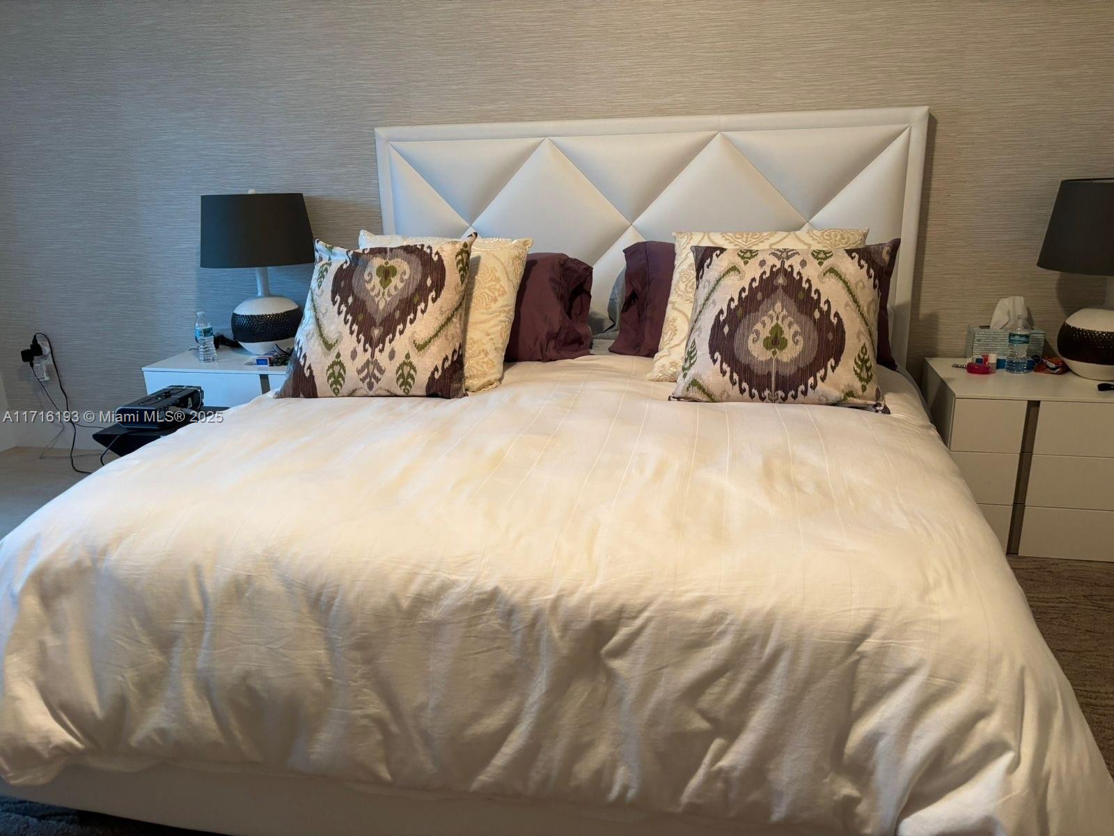 20201 East Country Club Drive, Unit 409 Aventura, FL 33180 - Photo 9 of 12 a bedroom with a bed and a tv