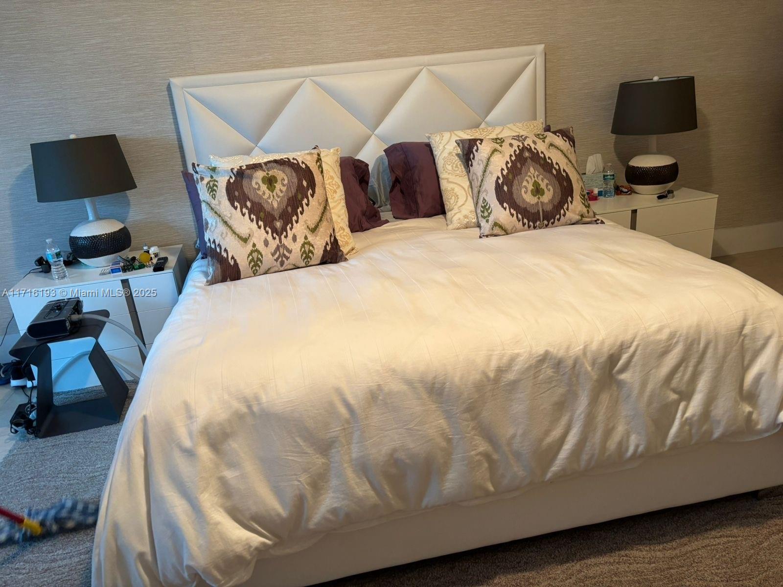 20201 East Country Club Drive, Unit 409 Aventura, FL 33180 - Photo 10 of 12 a large bed sitting in a bedroom next to a tv