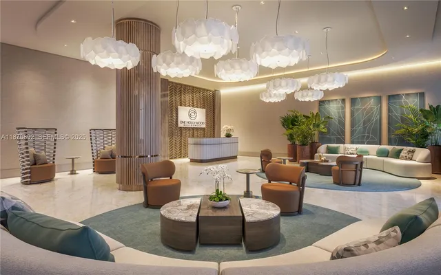 a living room with fireplace furniture and a chandelier