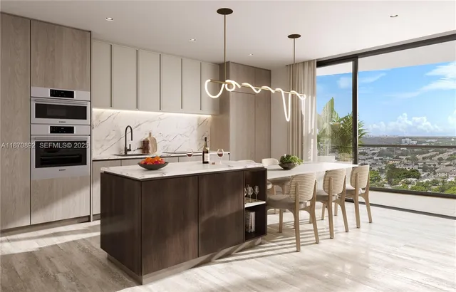 a kitchen with stainless steel appliances granite countertop a stove and a refrigerator