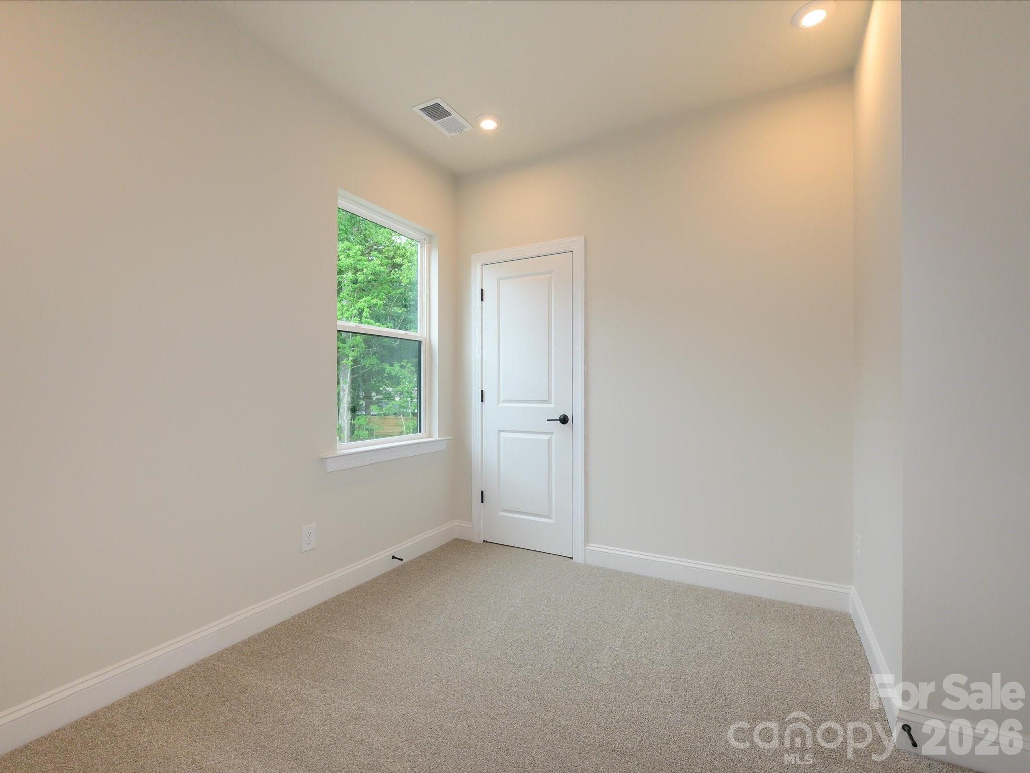 403 Old Town Vlg Road Waxhaw, NC 28173 - Photo 17 of 23 a view of an empty room with a window
