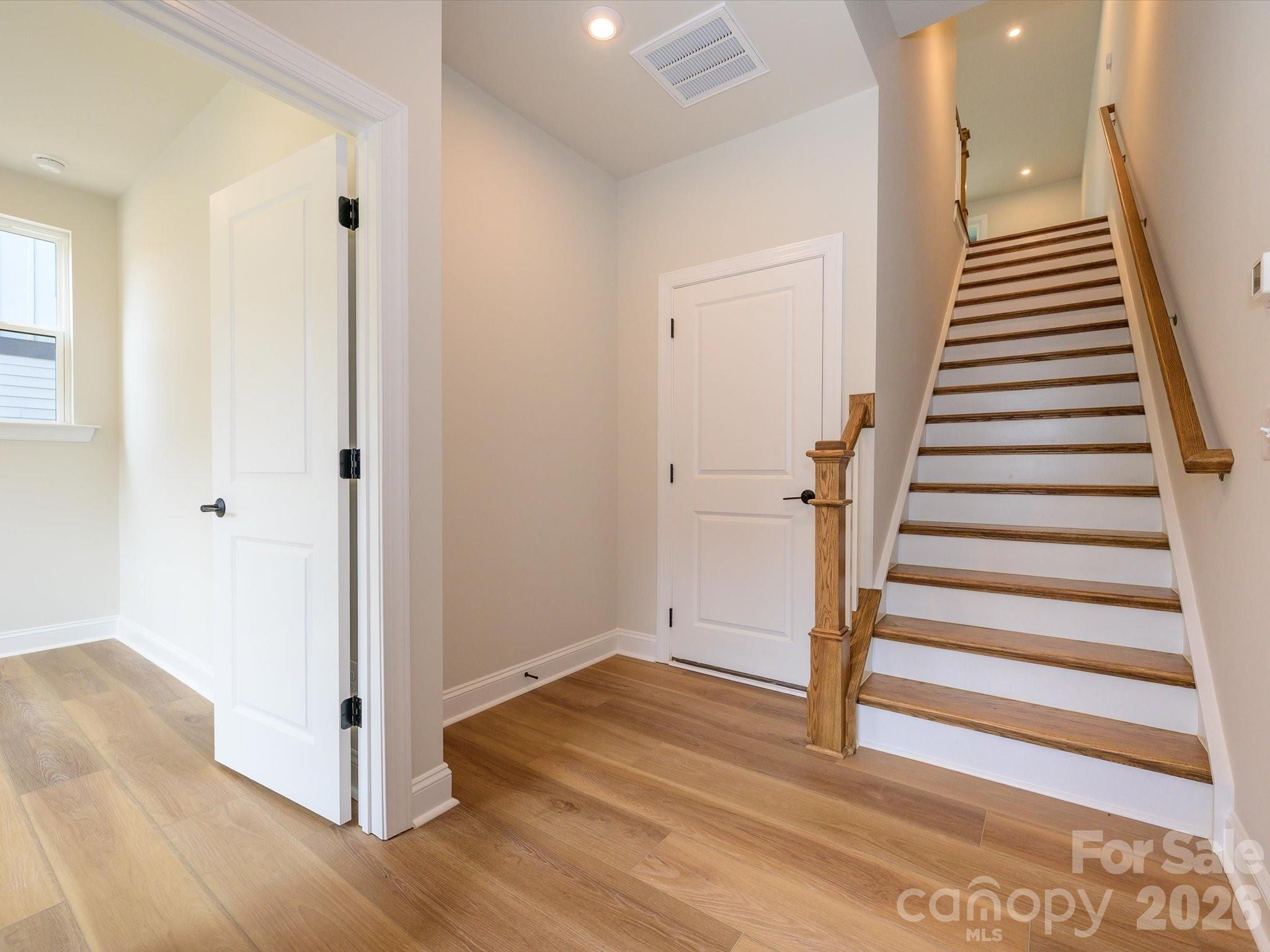 403 Old Town Vlg Road Waxhaw, NC 28173 - Photo 3 of 23 a view of a hallway with wooden floor and entryway